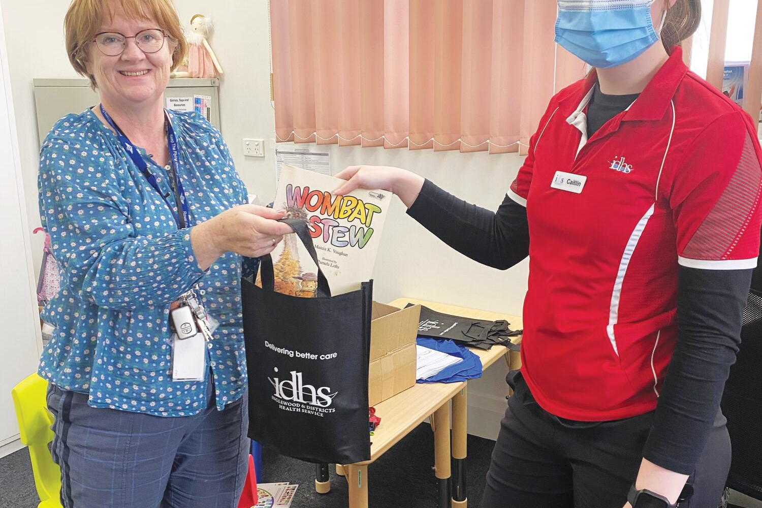 Lisa Armitage and Caitlin Sturgess prepare the promotional bags.