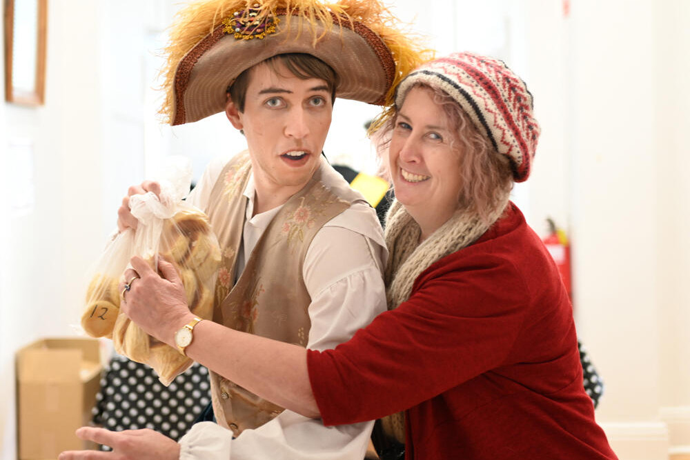 PIRATE AT WORK: Louise Bewley catches cast member Stephen Capon trying to nick a bag of scones before he hit the stage in Inglewood