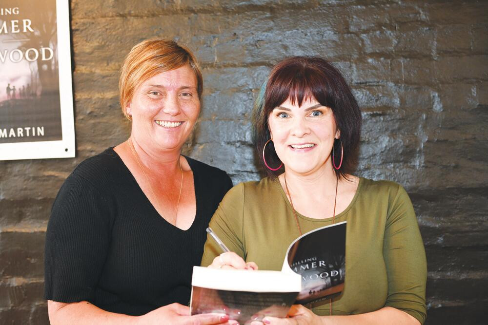 Tanya Leach (left) was among the first to snap up a copy of Mickey’s new book complete with autograph on Saturday. LH PHOTO