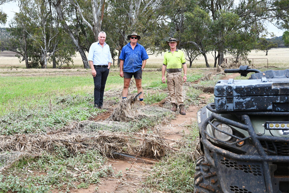 Hundreds of kilometres of fencing lost in the summer storm floods ... Peter Walsh with Peter Gibson and John Tonkin. LH PHOTO