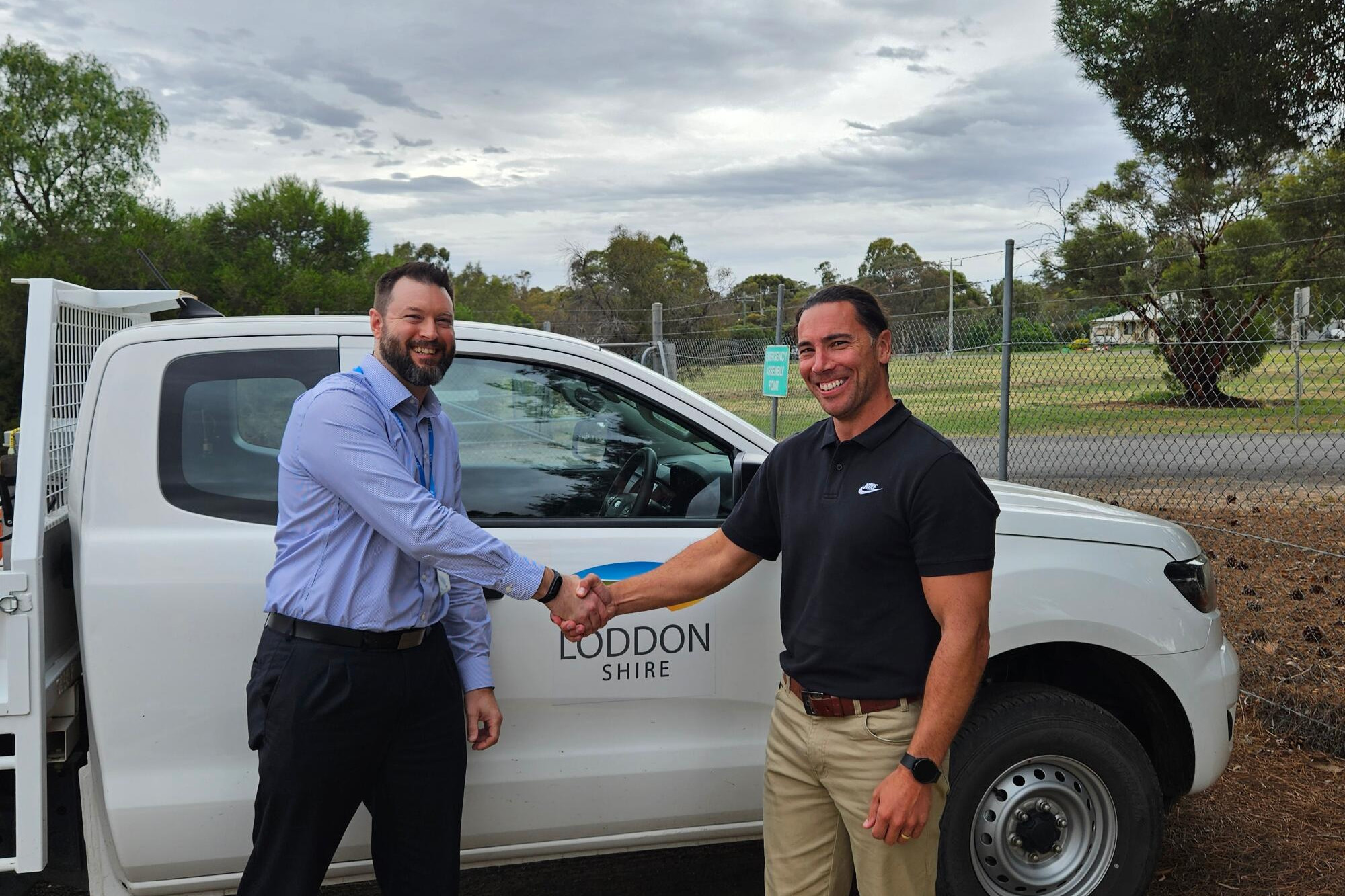 Handing over ... the department’s contract manager Trent King and Loddon Shire works manager Daniel Lloyd.