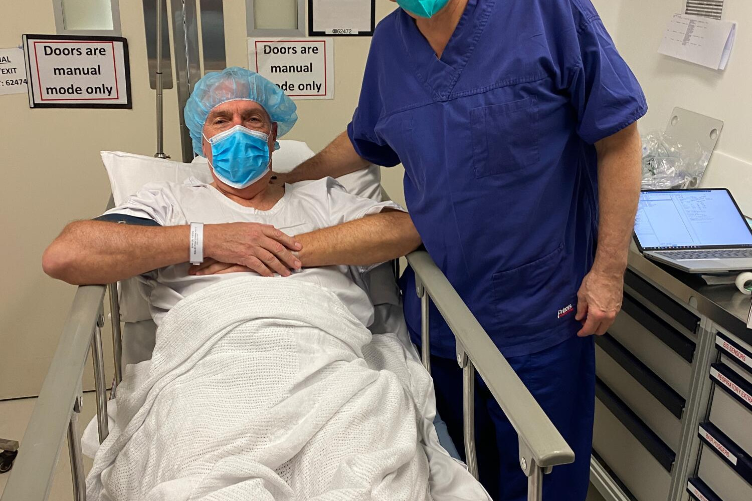 Peter Walsh with surgeon Will Edwards just before being wheeled into the operating theatre.