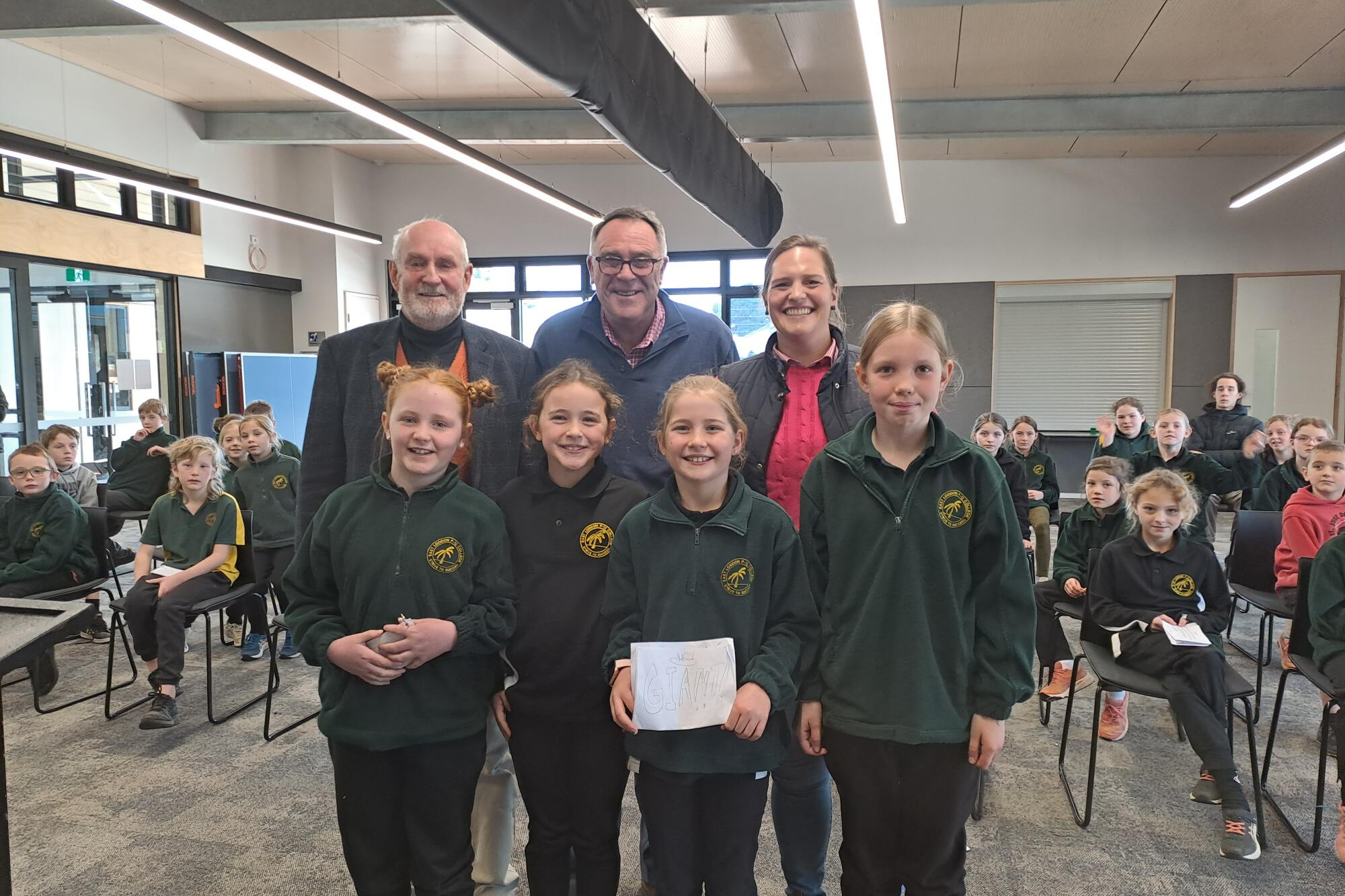 Junior public speaking finalists (front) Hazel Phillips, Ruby Hocking, Emily Lister and Abby Smith with judges John Davidson, Chris Earl and Felicity Davidson.