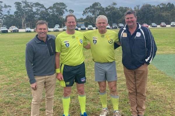 Umpires in arms: marking Mal's 700th - feature photo