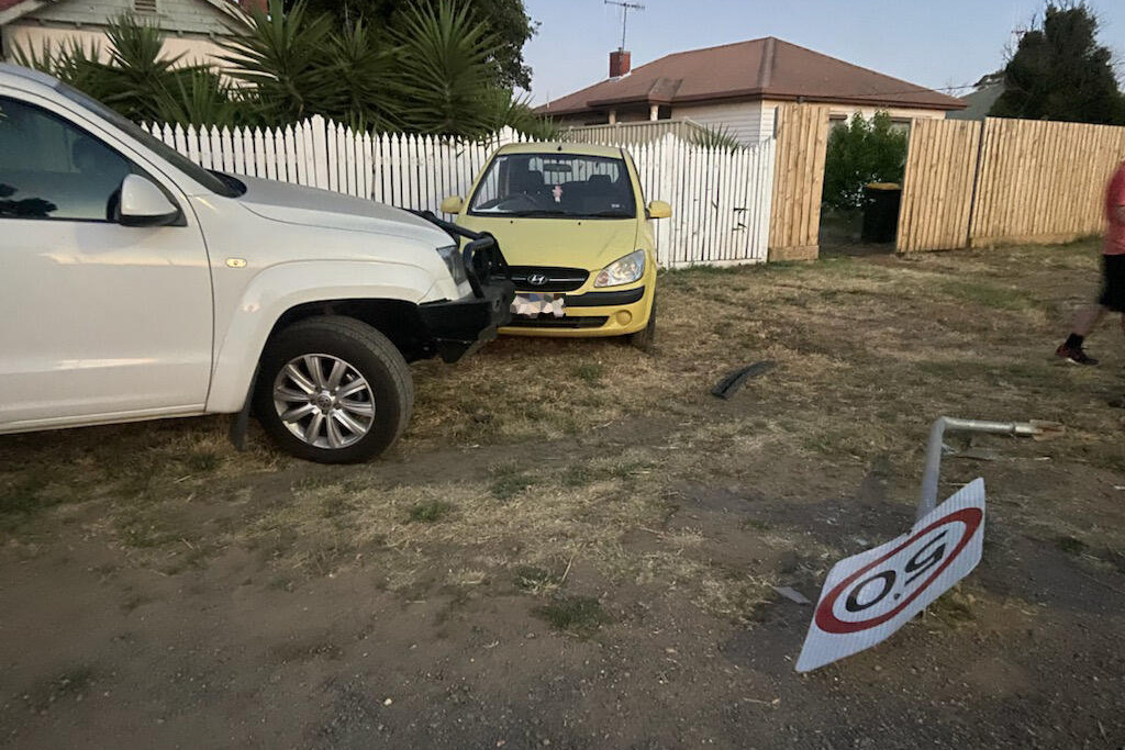 Car pushed into fence - feature photo