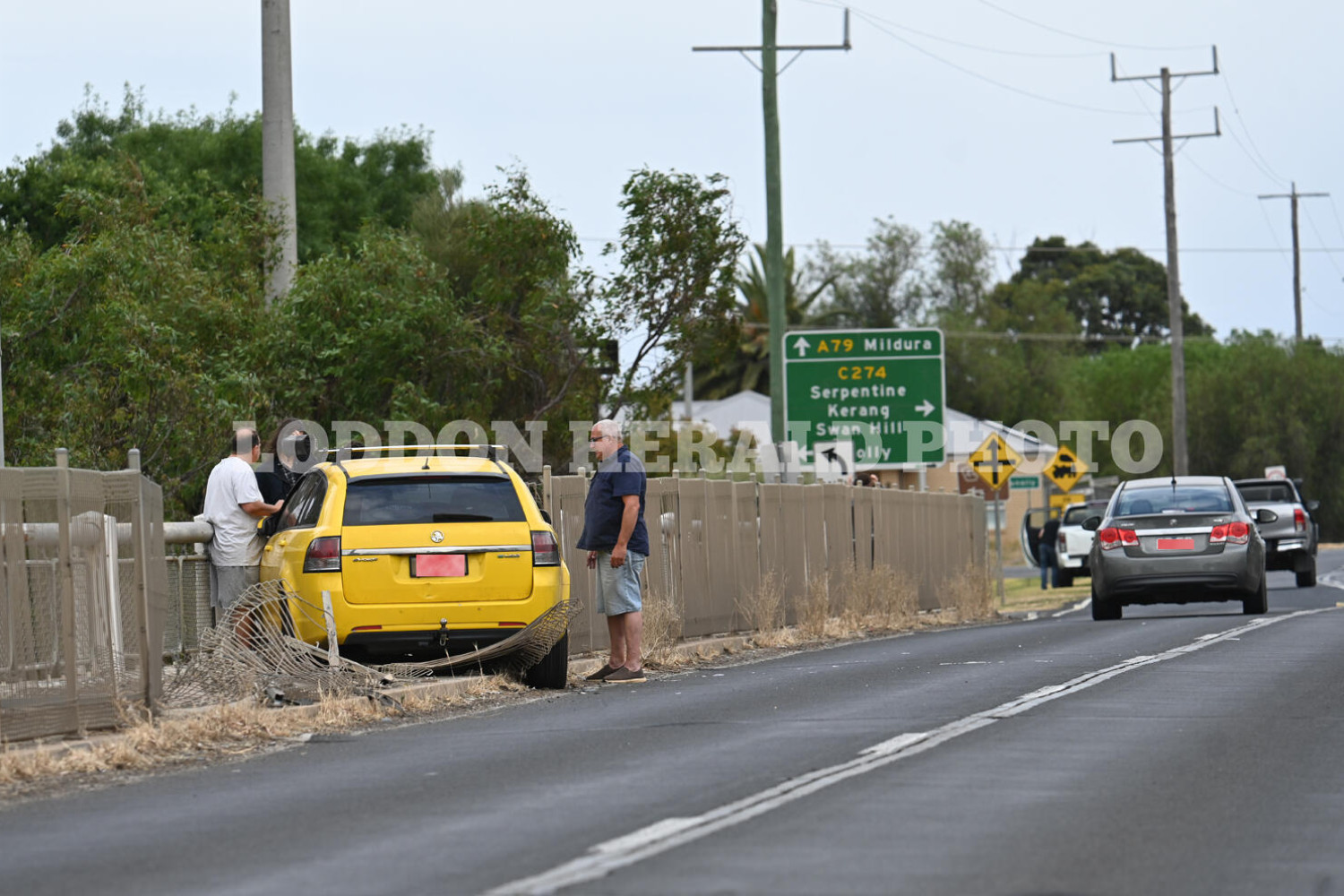 Car smashes into bridge pedestrian safety fence - feature photo