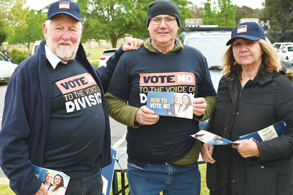 Frank Cooper, Neville Mills and Julie Mills encourage “no” votes. LH PHOTO