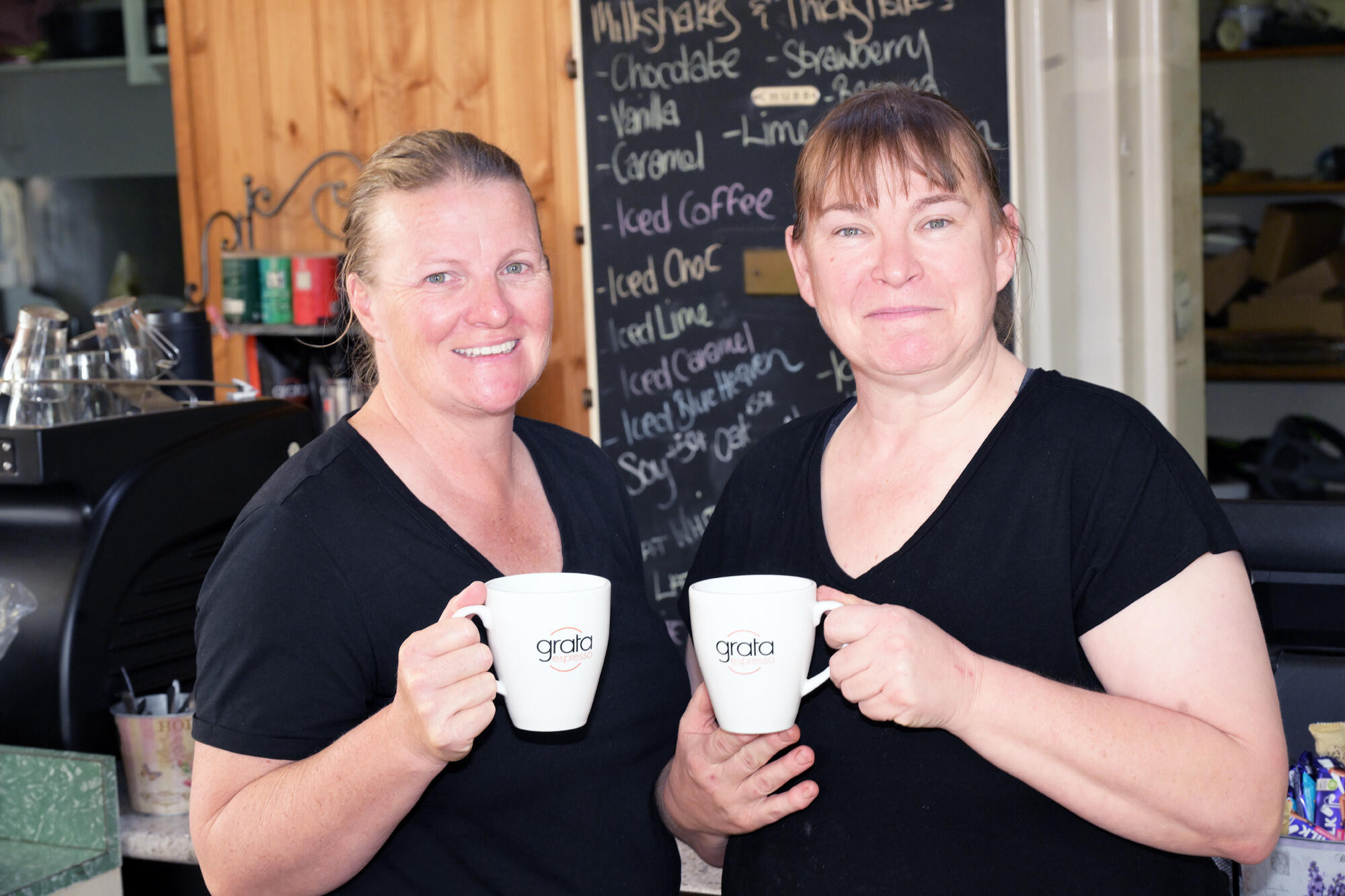 Meg Stewart and Janine Worth welcome customers to the Coffee Bank. LH PHOTO