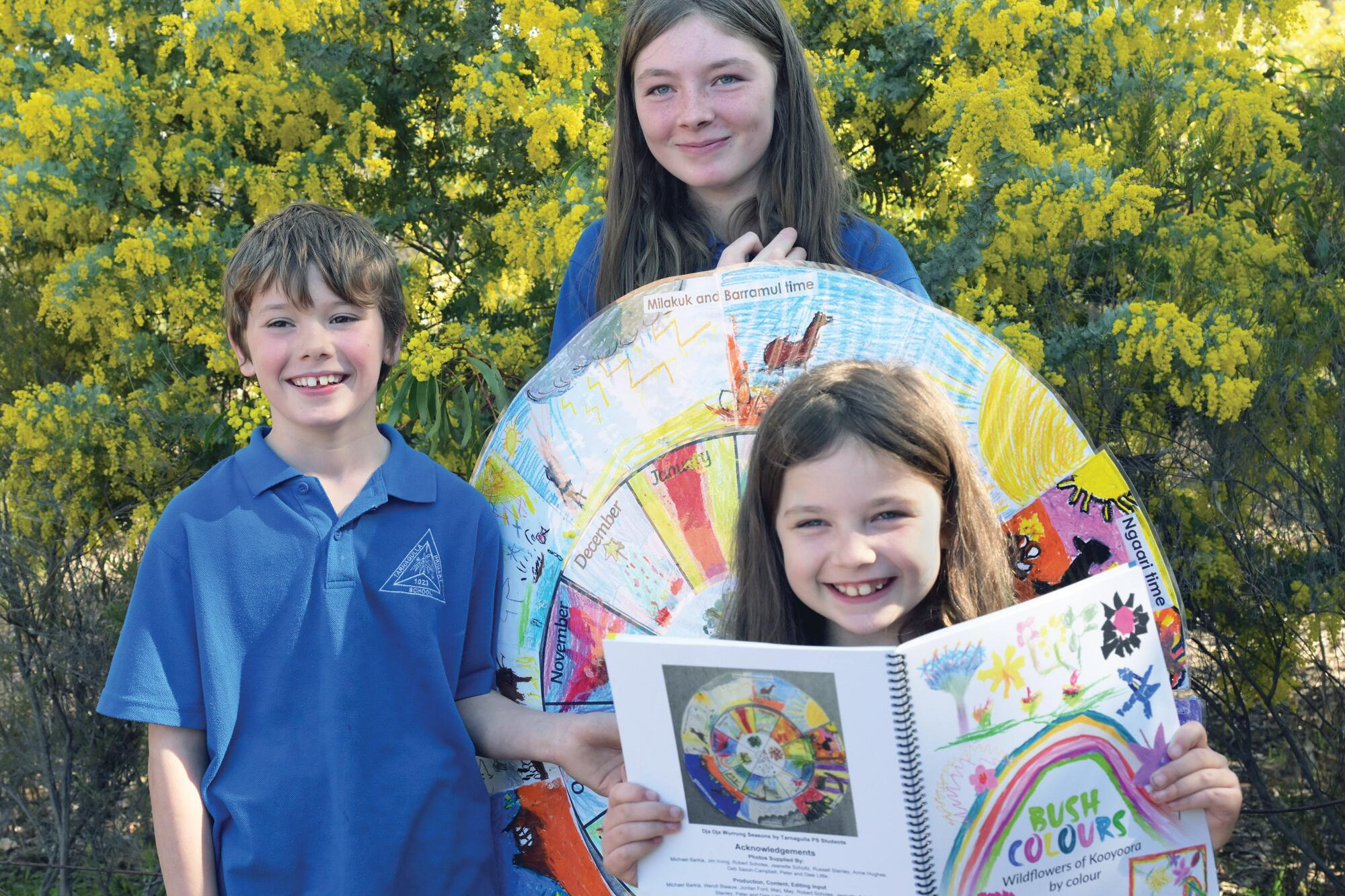 Vivi Read, Nevaeh Long and Skylah Long have their artwork featured on the cover of Bush Colours, the latest field guide produced by Friends of Kooyoora. LH PHOTO