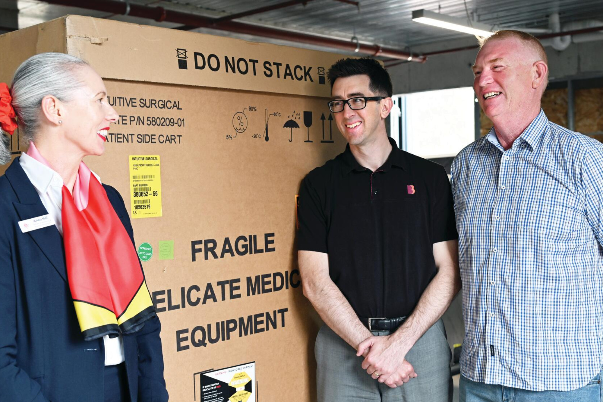 St John of God appeal director Anna Hill with the bank’s Michael Prowse and Tim Birthisel as the da Vinci robot arrives. LH PHOTO