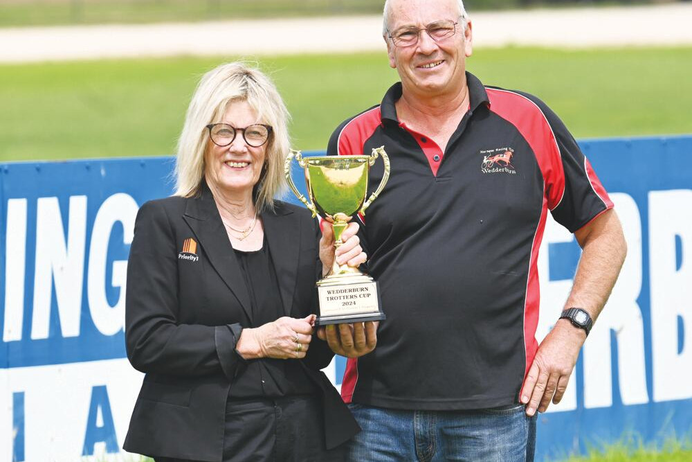 Priority One’s Julie Benaim and harness racing club president Bruce Hargreaves get ready for Suinday’s cup meeting. LH PHOTO
