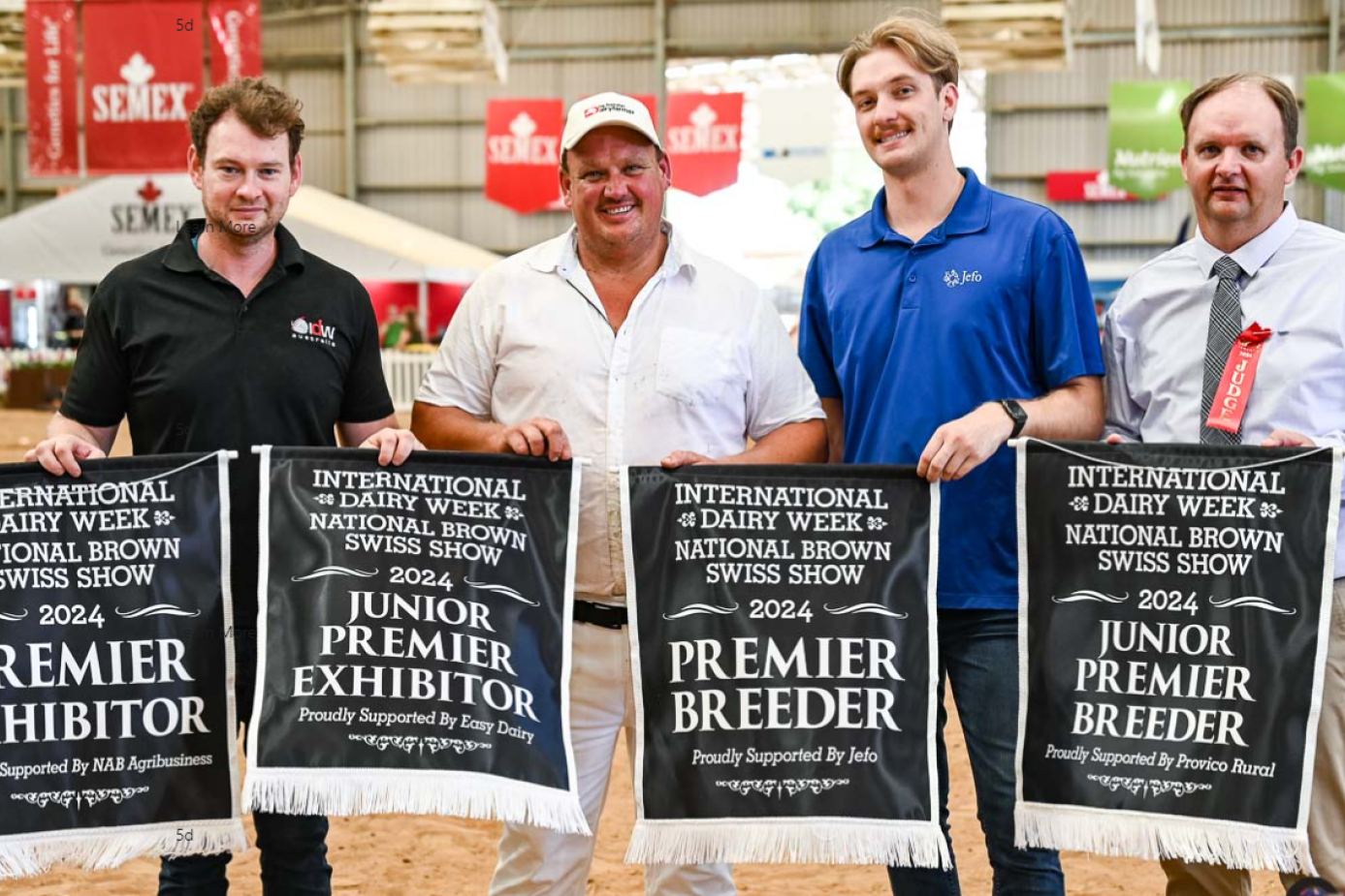 International Dairy Week director Declan Patten and top breeder Ben Govett (second left) with Ed Van Ravesteyn and judge Neil van Rensburg