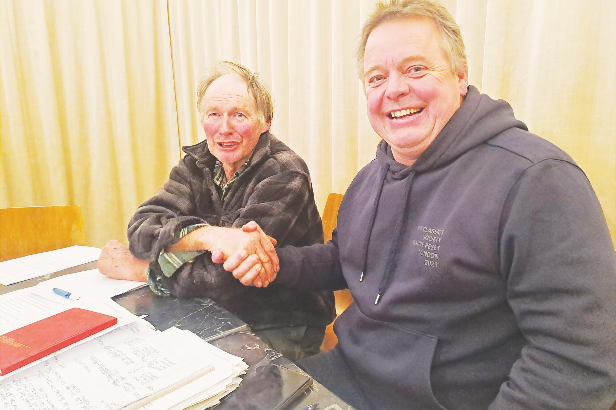 New president John Daldy (right) thanks Michael Rose as his calls time after 39 years as secretary