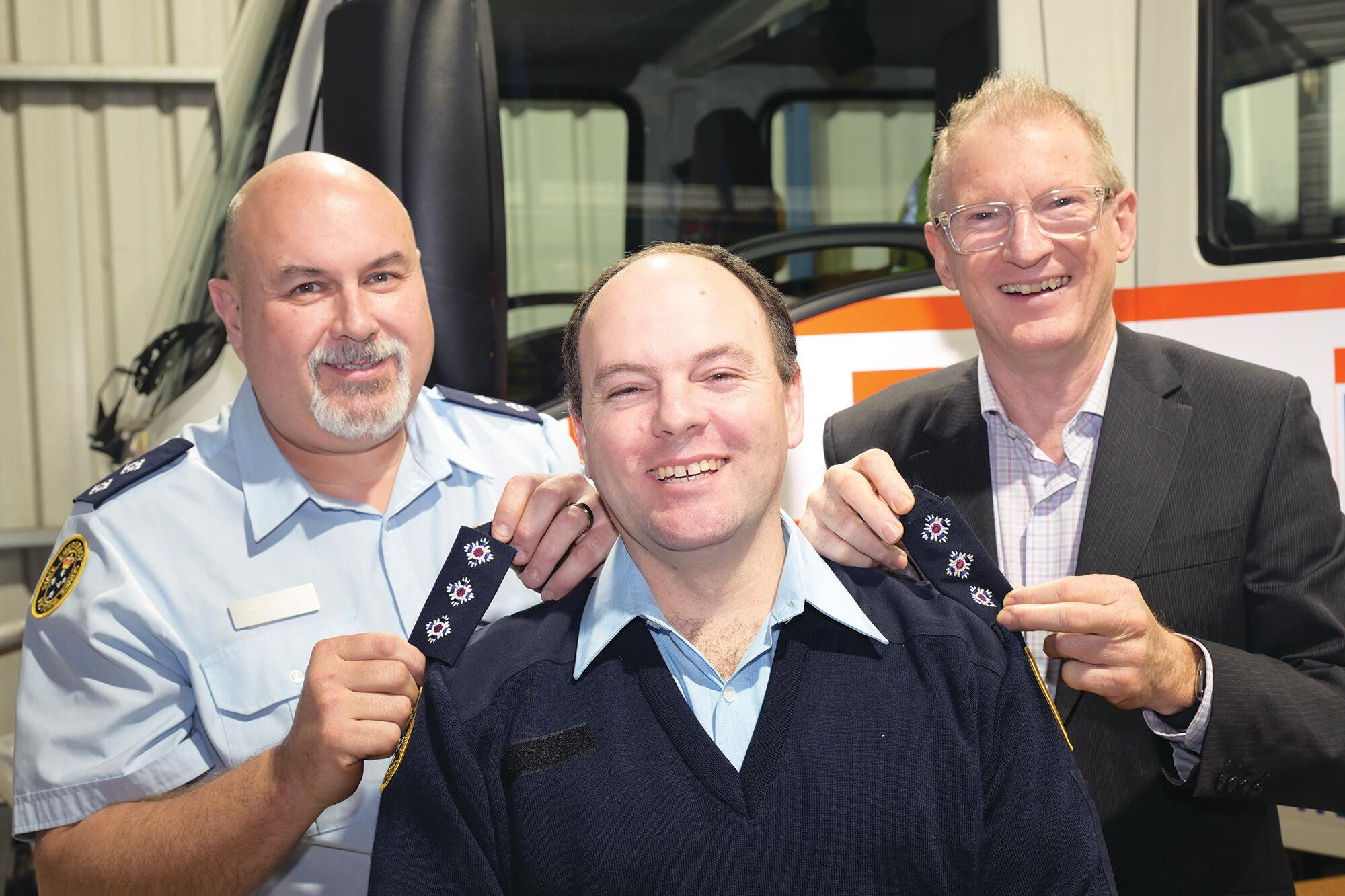 Michael George (centre) steps up as unit controller after receiving the badges of office from Mike Bagnall and Greg Leach on Monday night. LH PHOTO
