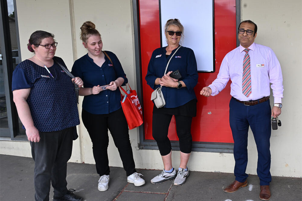 Staff at Inglewood Pharmacy wait for power supplies to resume