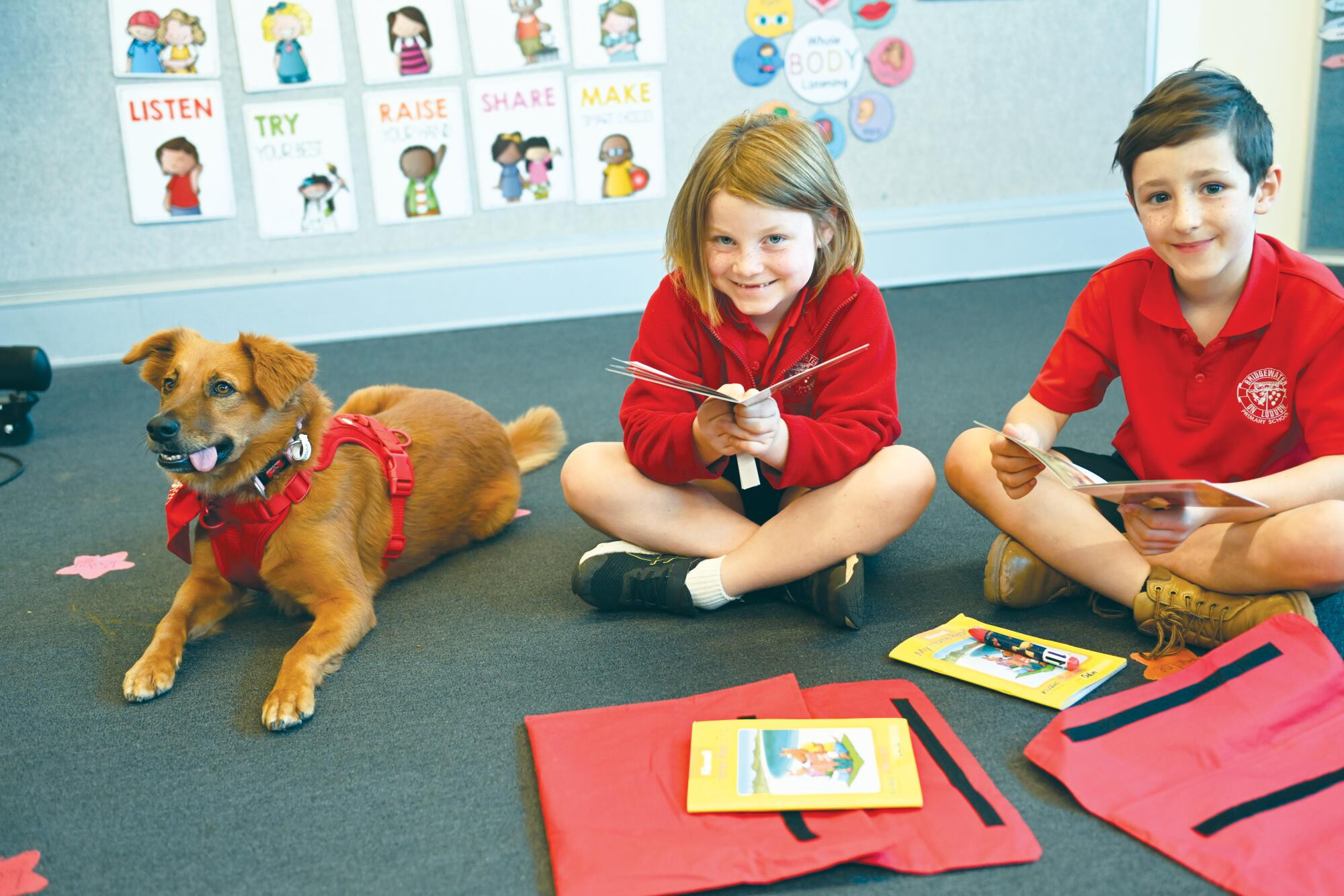 Poppie spends class time with Layla Warke and Odin Bennie on Tuesday. LH PHOTO