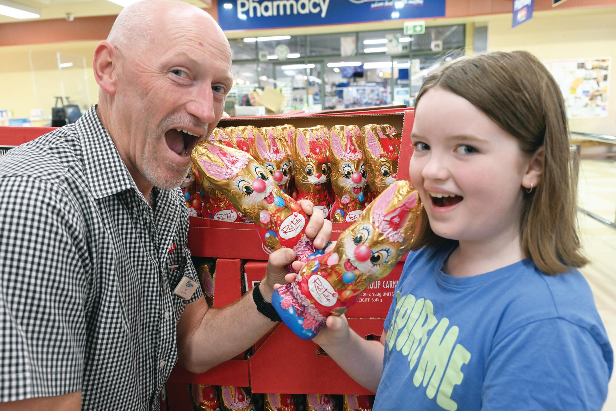Inglewood IGA manager Tom Ryan and Molly Mitchell-Chatfield ready to devour the Easter chocolate. LH PHOTO