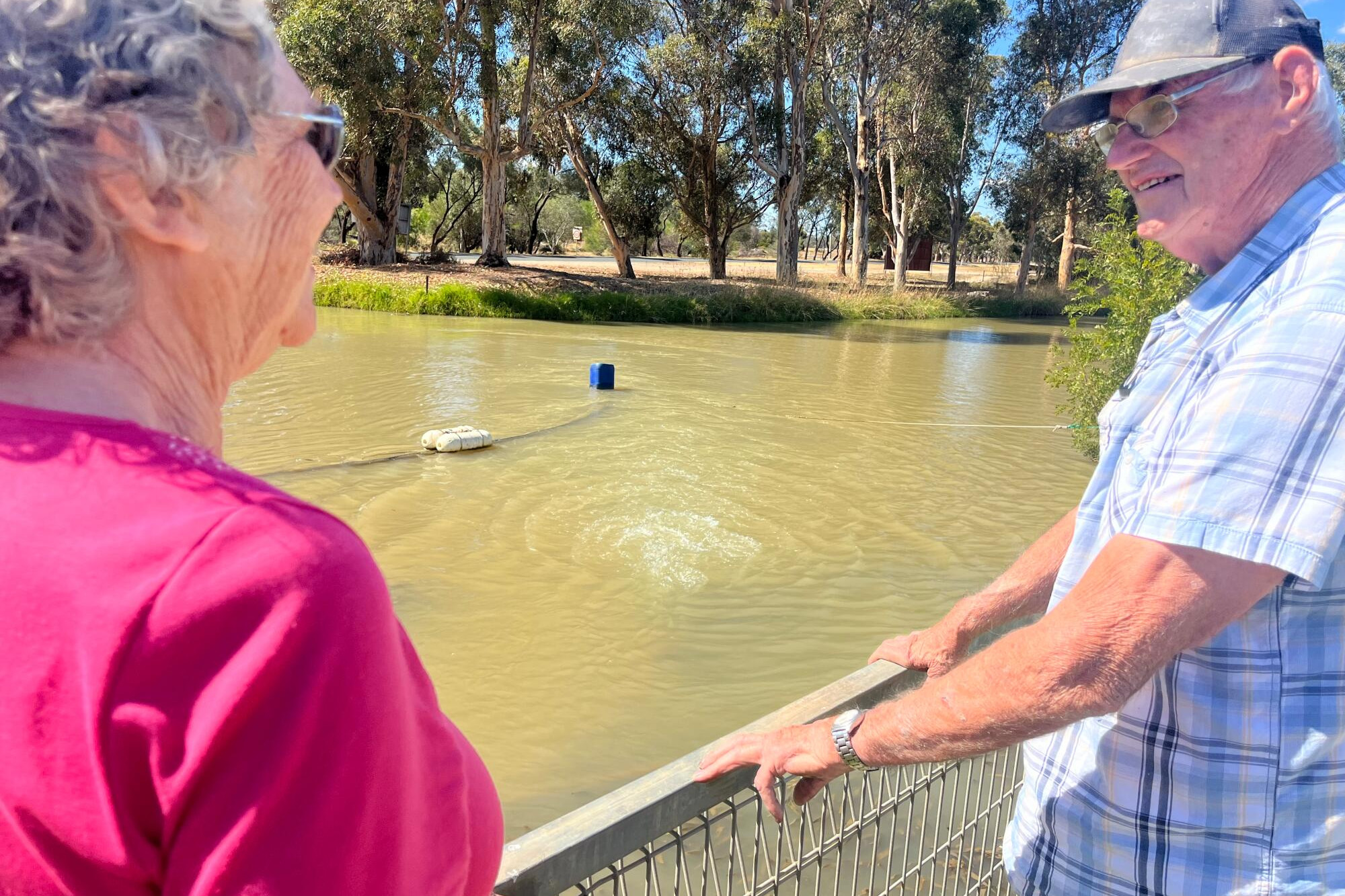 Cathy Haw and Kevin Sutton checking the water flow from Number 3 Channel at Little Lake Boort.