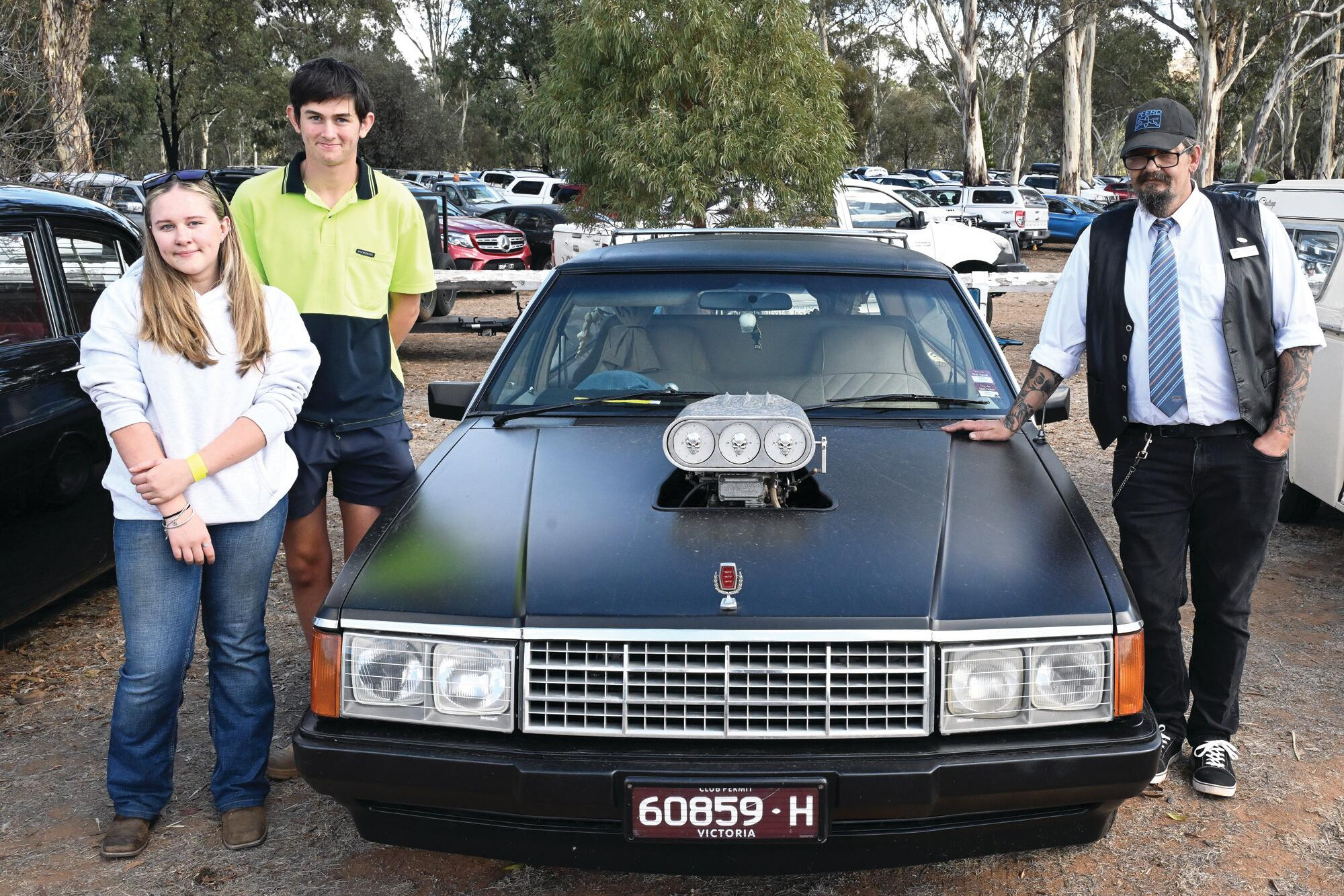Elissa Raeburn and Connor Alexander check out Nick Angelo’s custom-made hearse. LH PHOTO