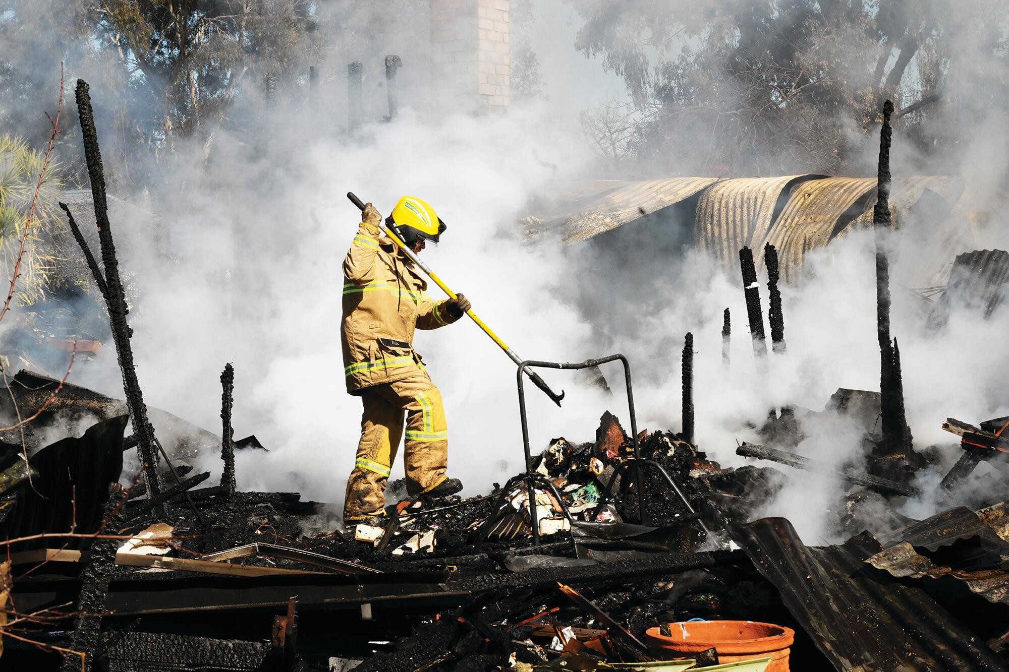 Fire brigades mopping up after Friday’s blaze. LH PHOTO