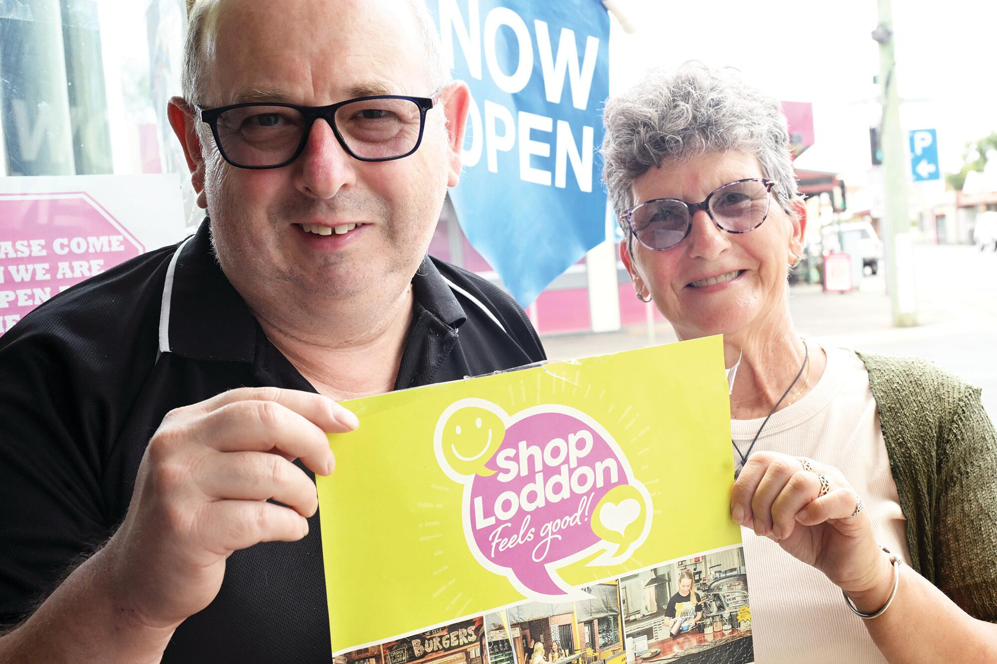 Charles Woodman of Carlie’s Fashion and Accessories and customer Annette Smith promote local shopping. LH PHOTO