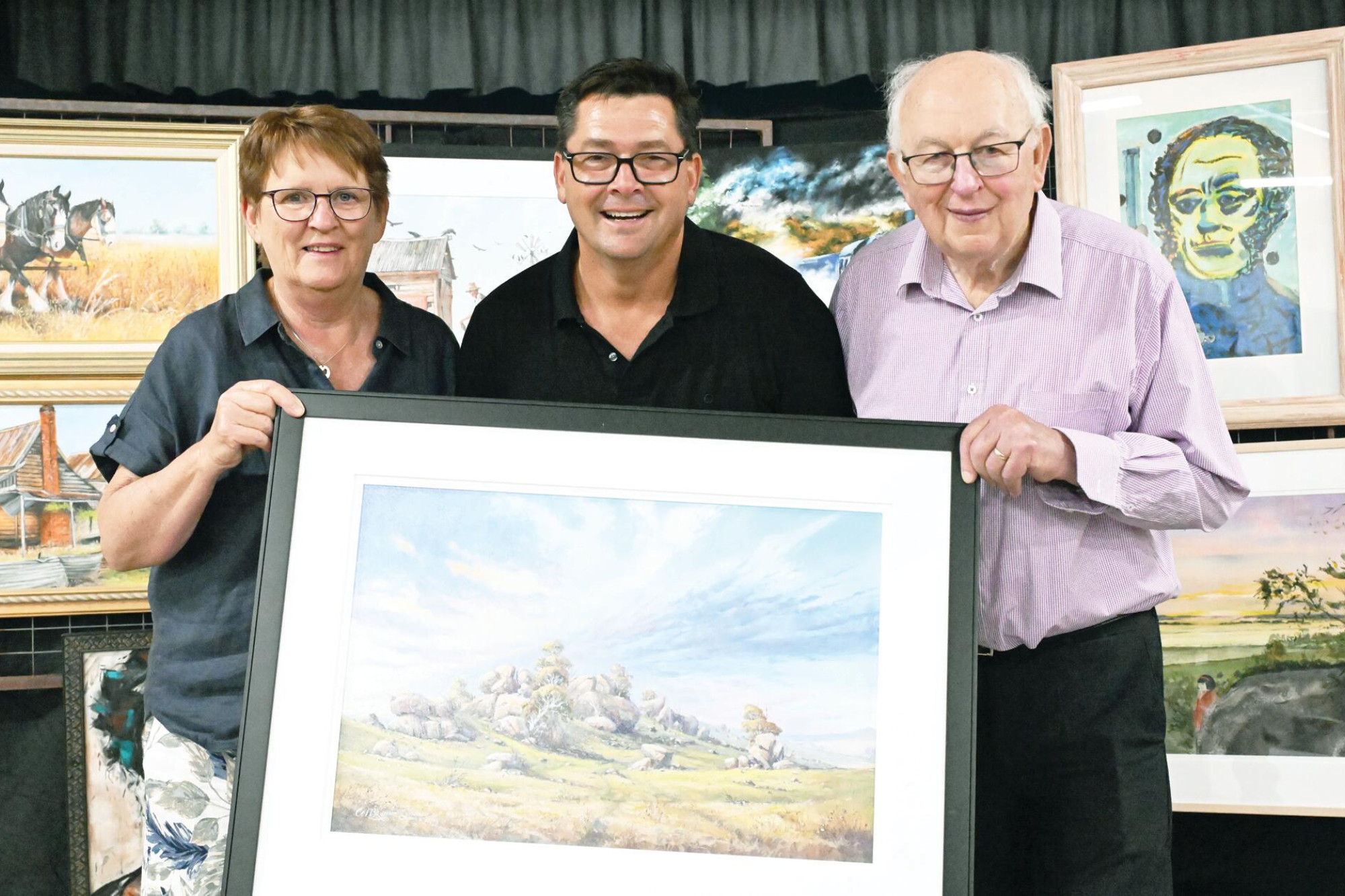 Organisers Anne Grogran, Drew Chislett and Terry Wood with Colin Brown’s best in show award. LH PHOTOS