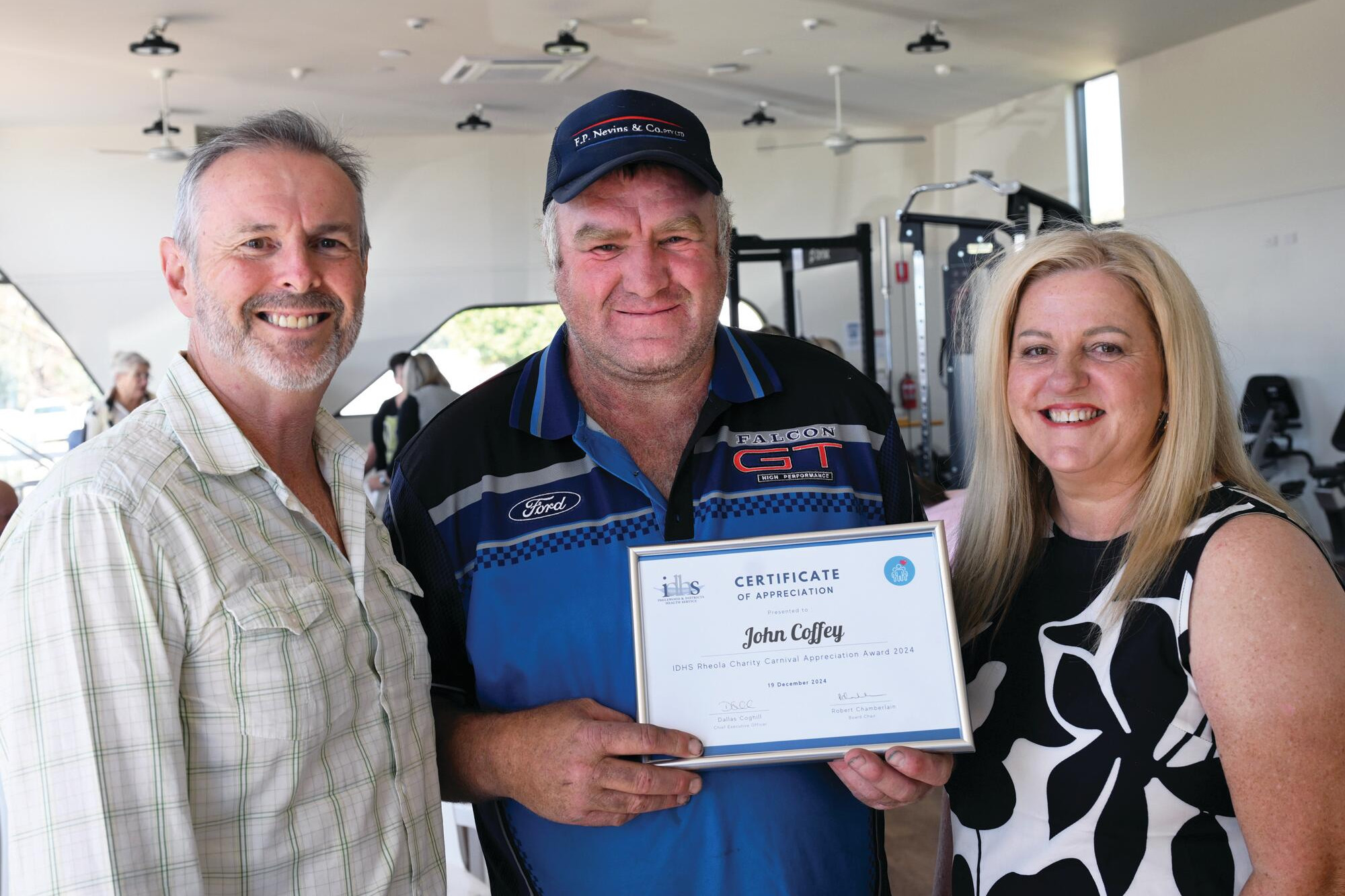 Rheola Charity Carnival volunteer John Coffey was recognised with a certificate of appreciation at the IDHS annual meeting. He was presented with the award by chair Robert Chamberlain and board member Anne-Maree Davis. LH PHOTOS