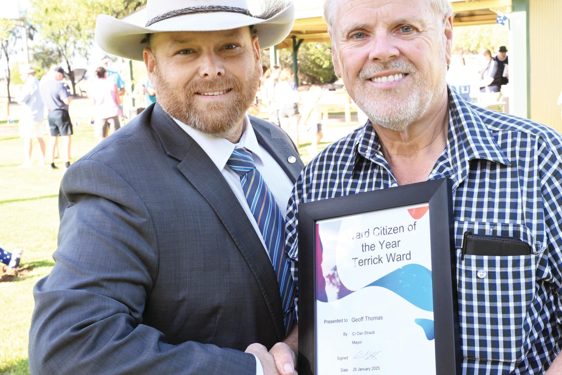 Mayor Dan Straub congratulates Terrick Ward citizen of the year Geoff Thomas. LH PHOTO