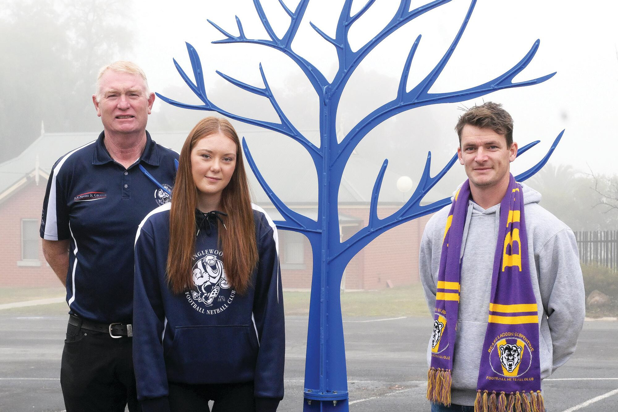 Inglewood’s Tim and Halle Birthisel and Serpentine’s Steve Gladman with the Blue Tree. LH PHOTO