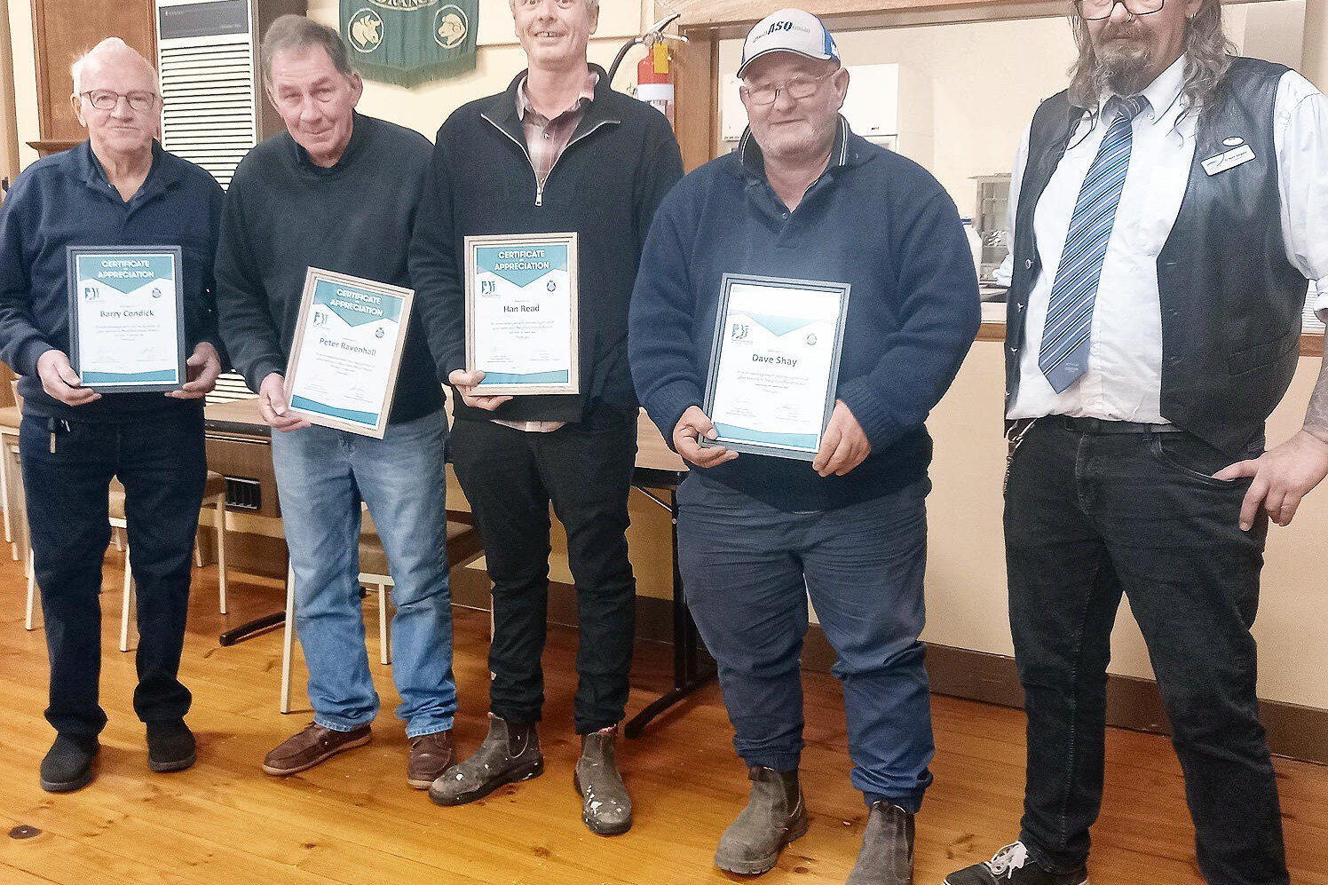 Barry Condick, Peter Ravenhall, Han Read and David Shay receive their service certificates from Cr Nick Angelo