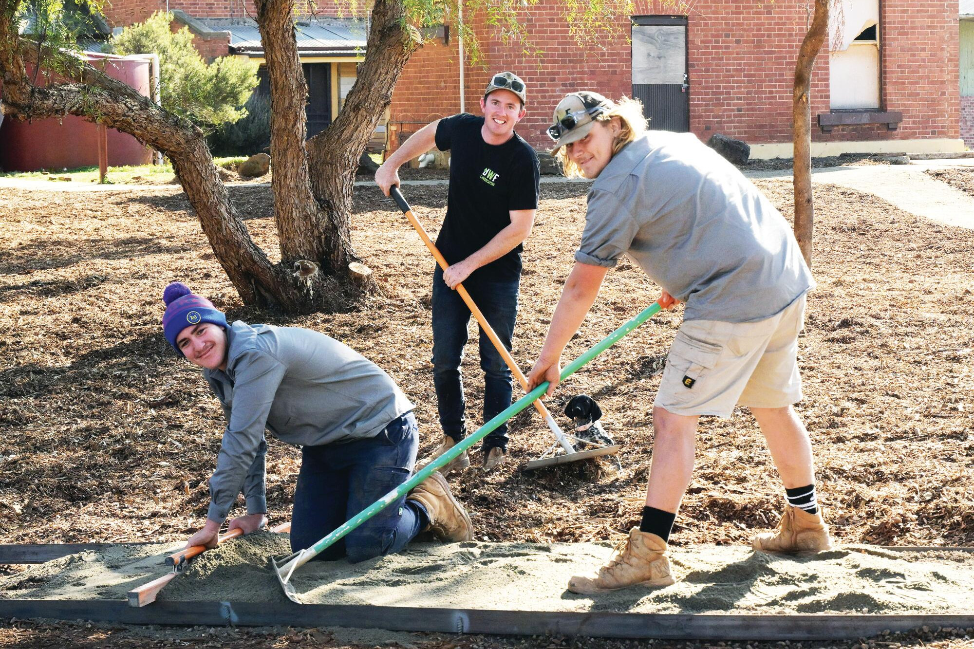 Jack Millane, Jake Flaherty and Harry Wicking prepare the garden paths. LH PHOTO