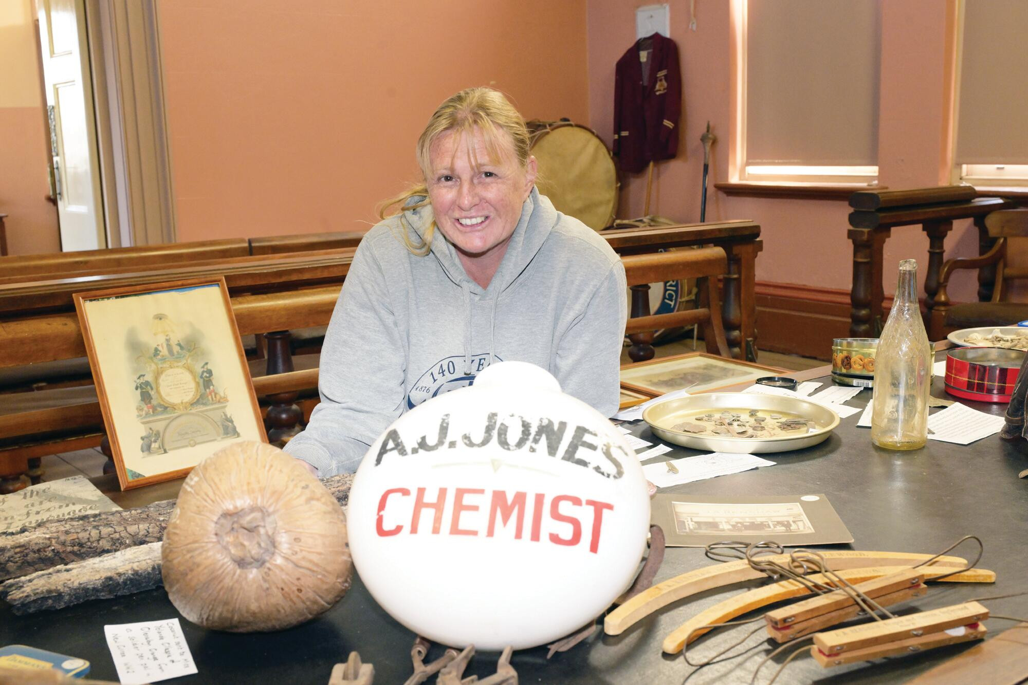 Historical society president Wendy Murphy with treasures of Inglewood’s past unearthed. LH PHOTO