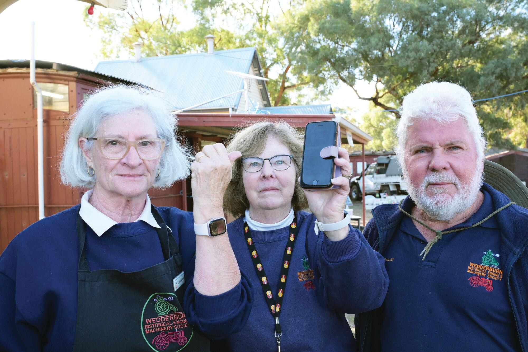 Sandra Maddox, Lois Goddard and Trevor Bailey searching for signal at the swap meet. LH PHOTO