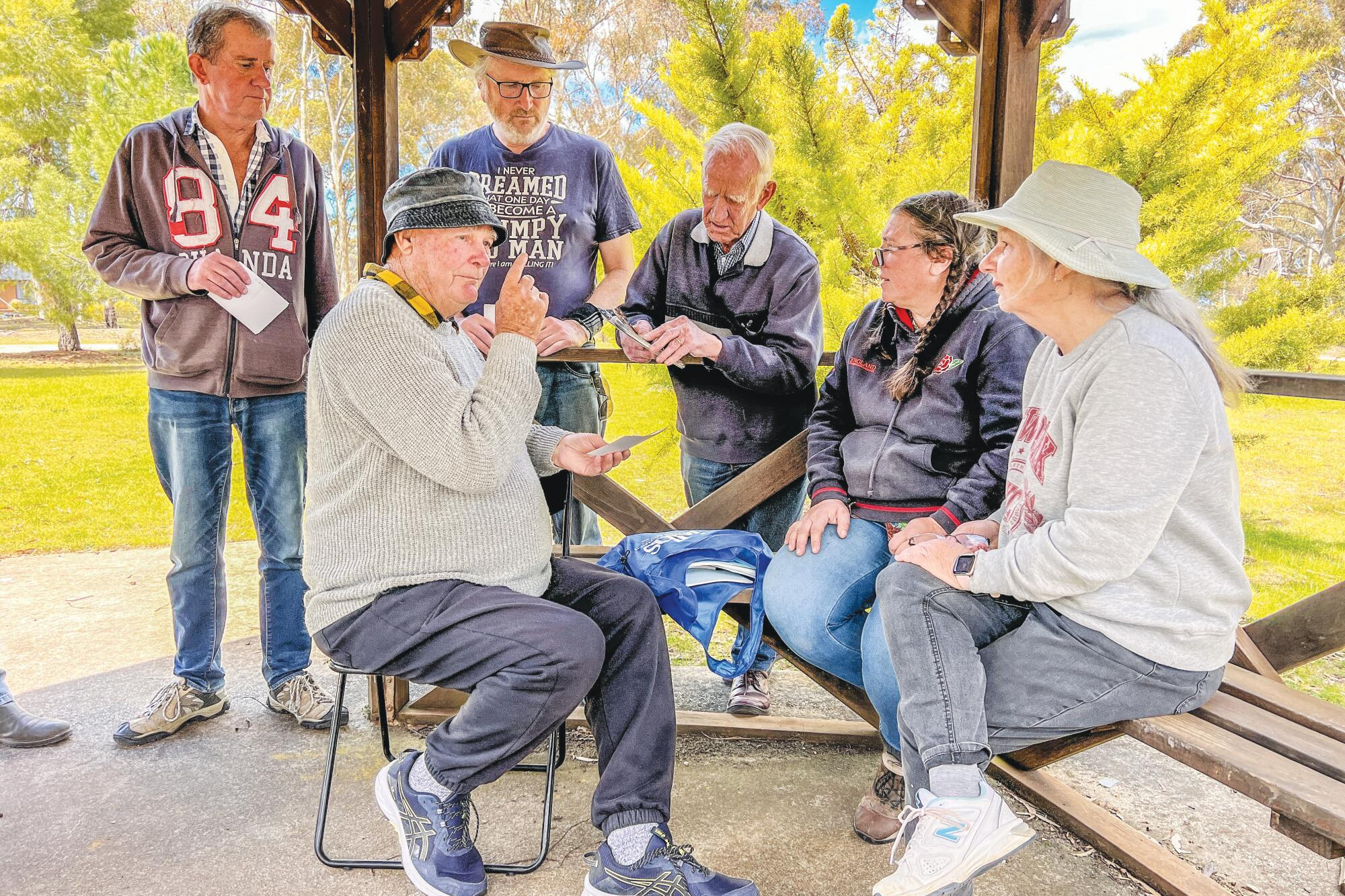 Howard Rochester shares stories on the history of the gardens with group members on Sunday. AP PHOTO