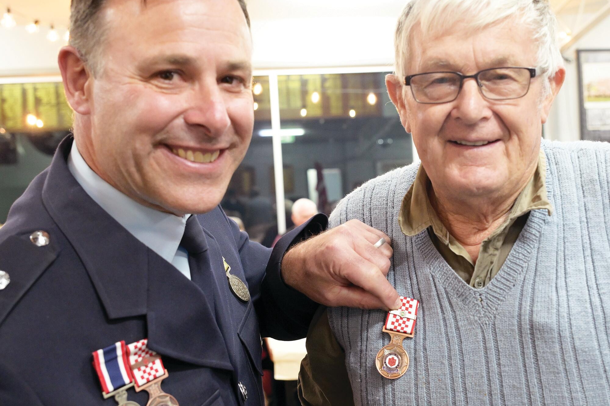 Bryan Sucking presents Paul Haw with his 60-year medal for service to the Yando brigade. LH PHOTOS