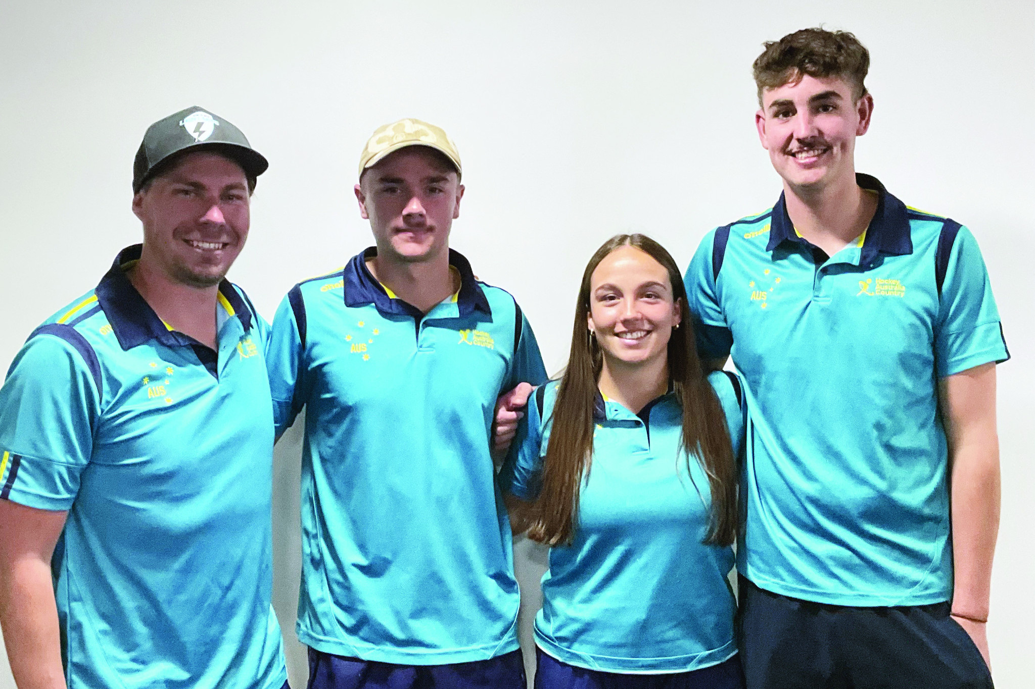 Coach Chris Mitchell and players Deacon Evans, Shelby Giorlando and Flynn Boyd.