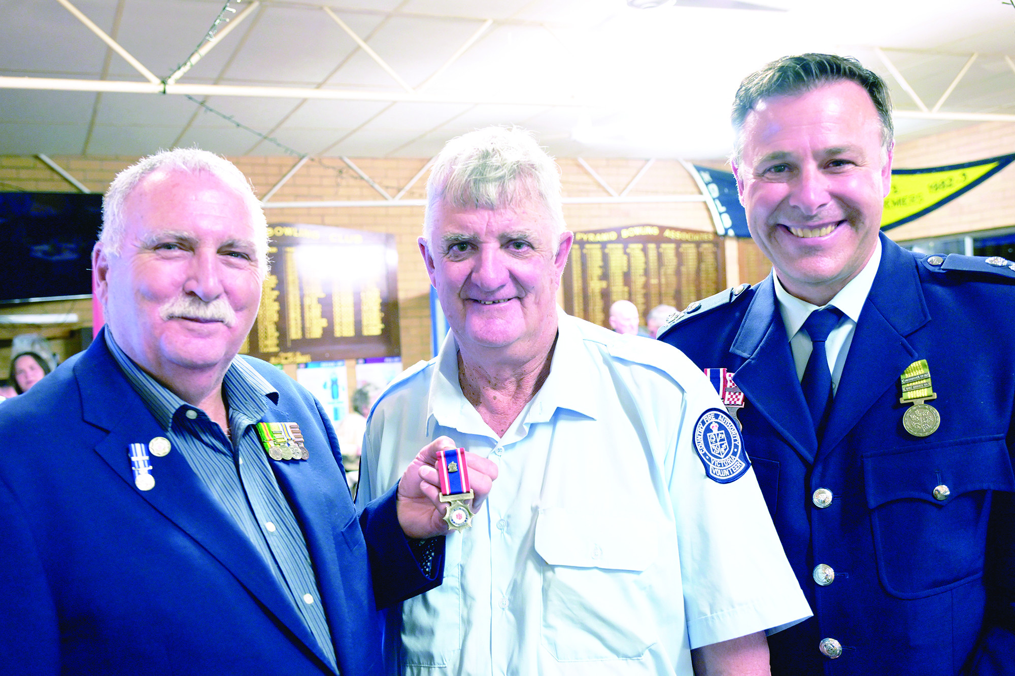 CFA board member Peter Shaw (left) and district commander Bryan Sucking with top medal recipient Steve Mann. L;H PHOTO